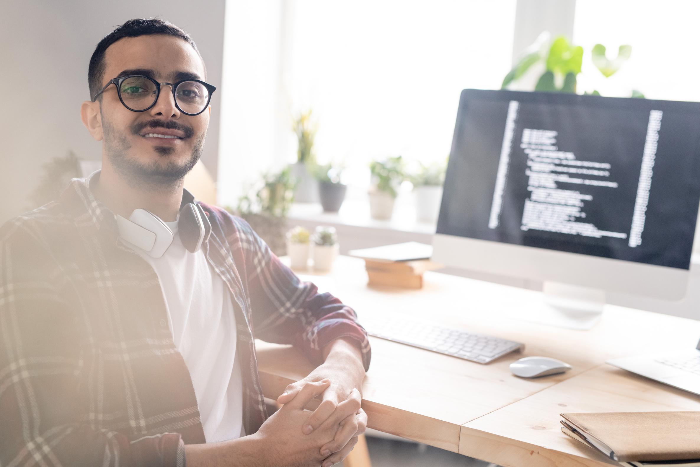 Positive coder at desk